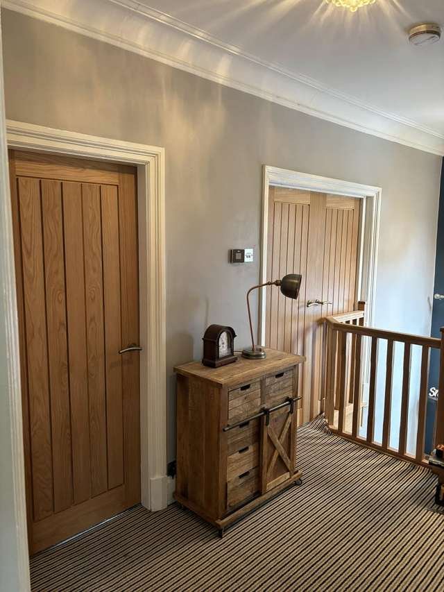 Oak internal doors and landing joinery by LMF Joinery