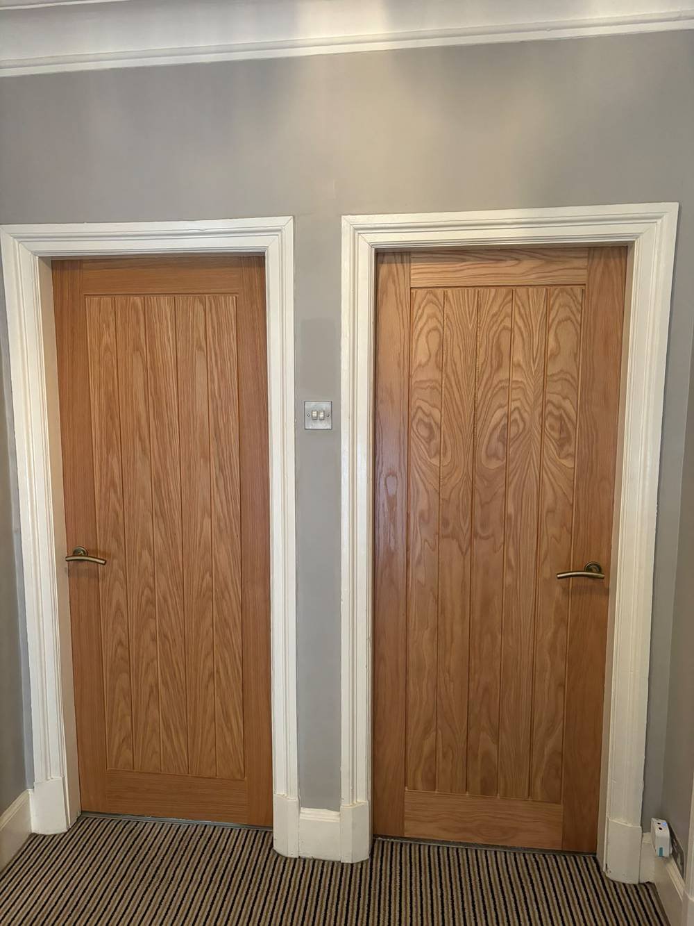 Two oak panelled doors fitted side by side